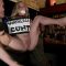 Brunette mistress Princess Donna Dolore and master Ramon Nomar fingering and anal fucking natural busty blonde slut Penny Pax in public crowded bar